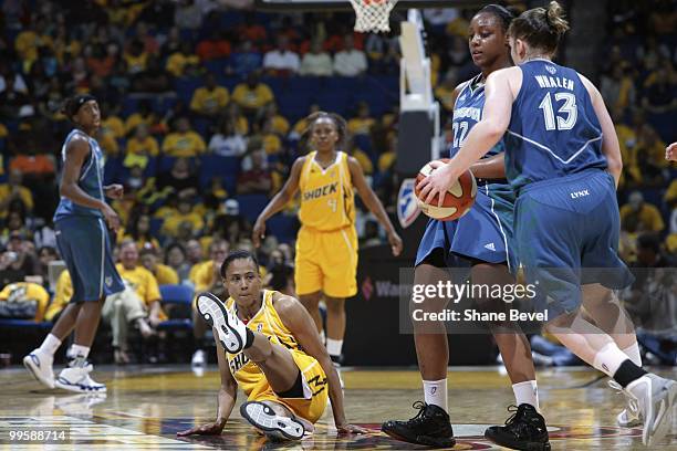 Marion Jones of the Tulsa Shock takes a spill after colliding with Monica Wright of the Minnesota Lynx during the WNBA game between Minnesota Lynx...