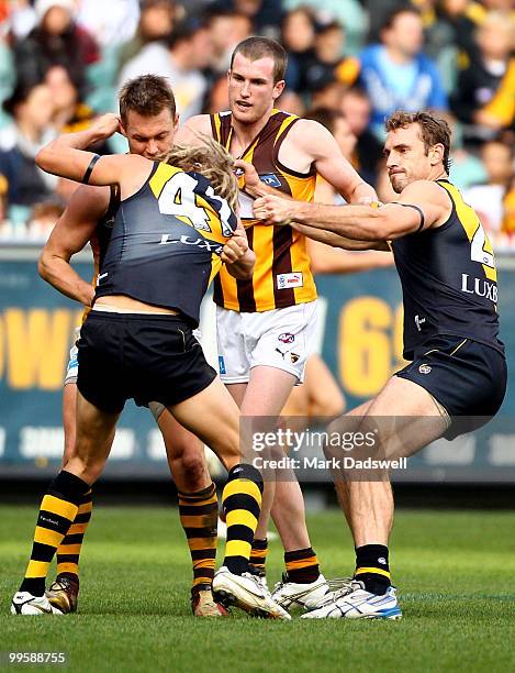 Ben Nason of the Tigers wrestles with Sam Mitchell of the Hawks during the round eight AFL match between the Richmond Tigers and the Hawthorn Hawks...