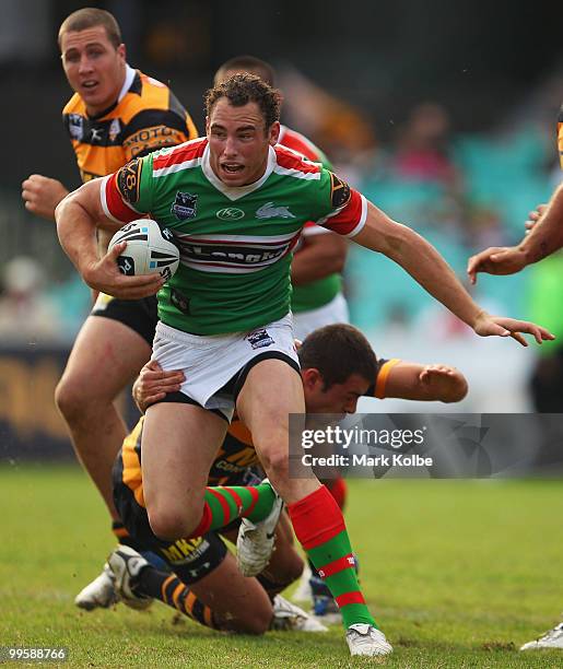 Luke Stuart of the Rabbitohs runs the ball during the round ten NRL match between the Wests Tigers and the South Sydney Rabbitohs at Sydney Cricket...