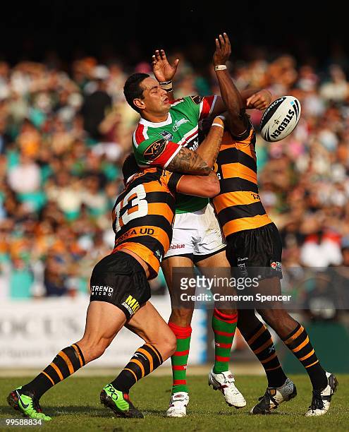 John Sutton of the Rabbitohs offloads the ball during the round ten NRL match between the Wests Tigers and the South Sydney Rabbitohs at Sydney...