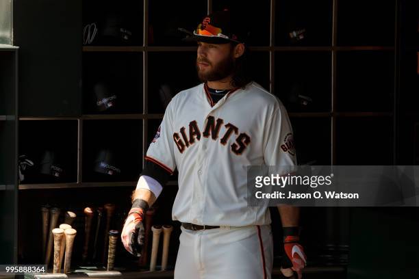 Brandon Crawford of the San Francisco Giants stands in the dugout before the game against the St. Louis Cardinals at AT&T Park on July 8, 2018 in San...