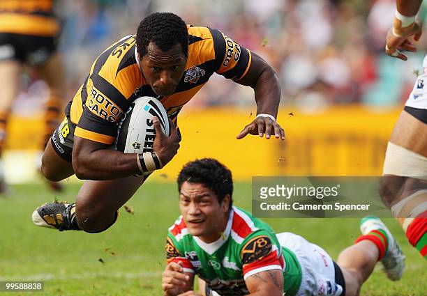 Robert Lui of the Tigers is tackled during the round ten NRL match between the Wests Tigers and the South Sydney Rabbitohs at Sydney Cricket Ground...