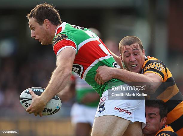 Colin Best of the Rabbitohs is tackled during the round ten NRL match between the Wests Tigers and the South Sydney Rabbitohs at Sydney Cricket...