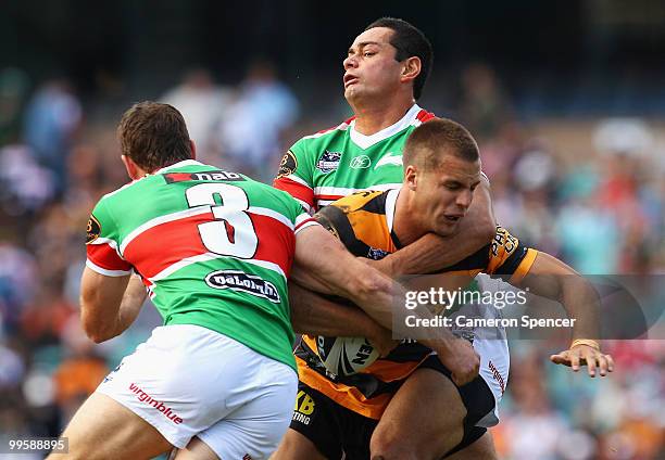 Beau Ryan of the Tigers is tackled during the round ten NRL match between the Wests Tigers and the South Sydney Rabbitohs at Sydney Cricket Ground on...