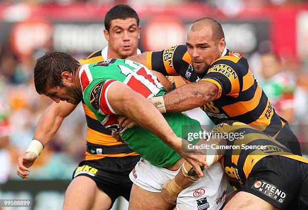 David Taylor of the Rabbitohs is tackled during the round ten NRL match between the Wests Tigers and the South Sydney Rabbitohs at Sydney Cricket...