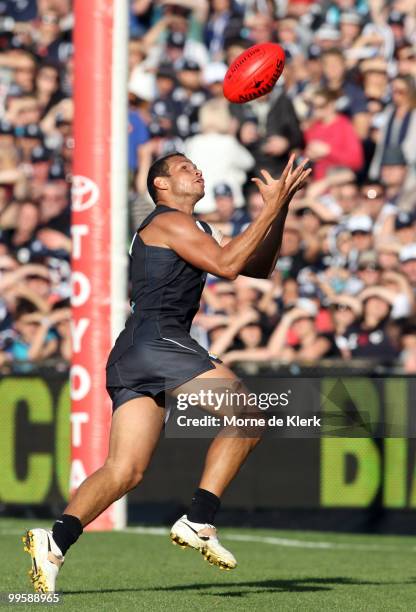 Daniel Motlop of the Power takes a mark before kicking a goal during the round eight AFL match between the Port Adelaide Power and the Carlton Blues...