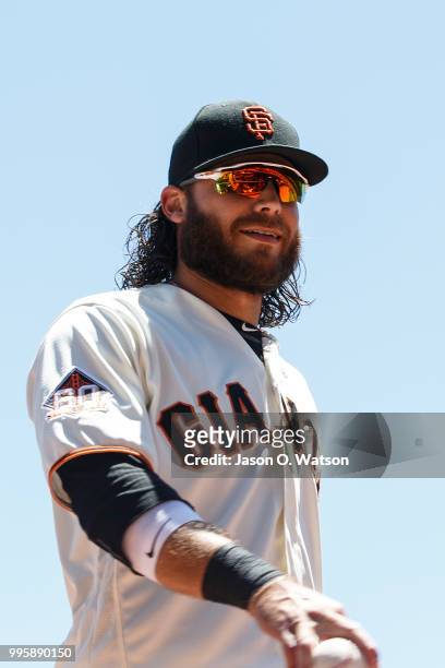 Brandon Crawford of the San Francisco Giants stands outside the dugout before the game against the St. Louis Cardinals at AT&T Park on July 8, 2018...