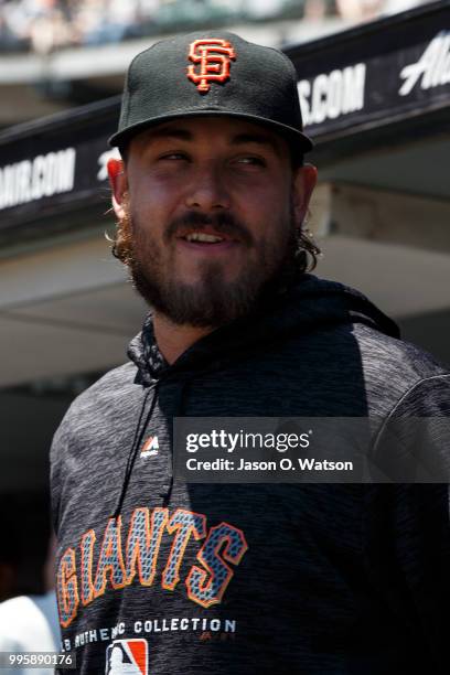 Ray Black of the San Francisco Giants stands in the dugout before the game against the St. Louis Cardinals at AT&T Park on July 8, 2018 in San...