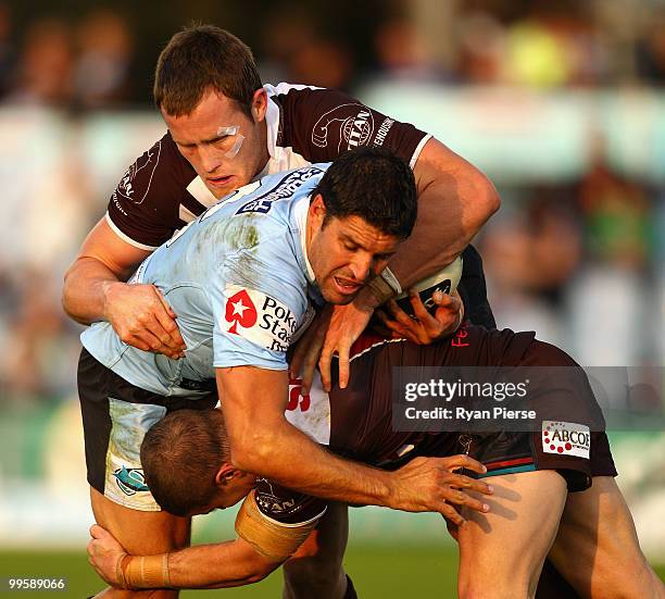 Trent Barrett of the Sharks is tackled by Gavin Cooper of the Panthers during the round ten NRL match between the Cronulla Sharks and the Penrith...