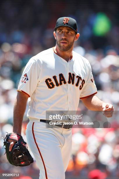 Madison Bumgarner of the San Francisco Giants returns to the dugout during the first inning against the St. Louis Cardinals at AT&T Park on July 8,...