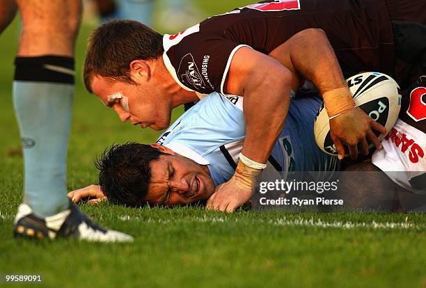 Trent Barrett of the Sharks is tackled by Gavin Cooper of the Panthers during the round ten NRL match between the Cronulla Sharks and the Penrith...