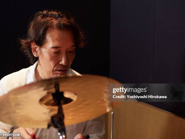 senior man playing drum set on recording studio - chofu stock pictures, royalty-free photos & images