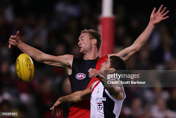 Jason Winderlich of the Bombers and Leigh Montagna of the Saints compete for the ball during the round eight AFL match between the St Kilda Saints...