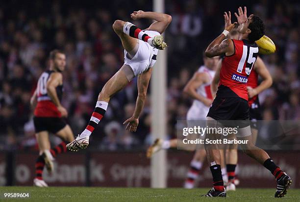 Leigh Montagna of the Saints and Courtenay Dempsey of the Bombers compete for the ball during the round eight AFL match between the St Kilda Saints...