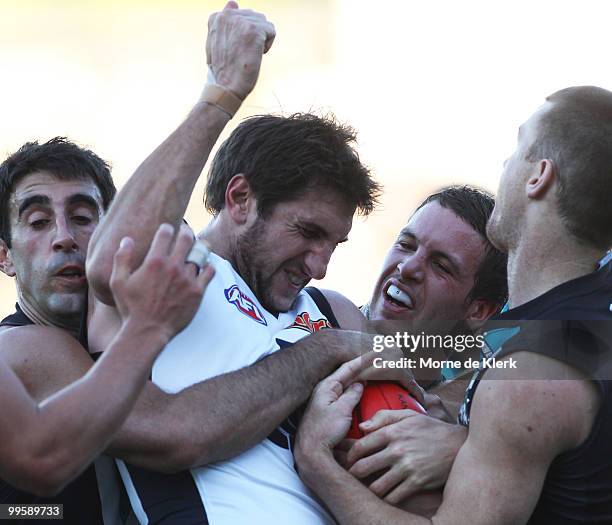 Jarrad Waite of the Blues is trapped between opposition players, Domenic Cassisi and Travis Boak of the Power during the round eight AFL match...