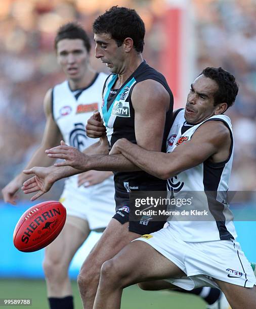 Domenic Cassisi of the Power is tackled by Eddie Betts of the Blues during the round eight AFL match between the Port Adelaide Power and the Carlton...