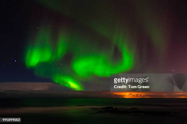 aurora borealis in sky with stars - ambiance bureau stockfoto's en -beelden