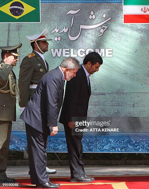 Iranian President Mahmoud Ahmadinejad and his Brazilian counterpart Luiz Inacio Lula da Silva review an honour guard during a welcoming ceremony for...