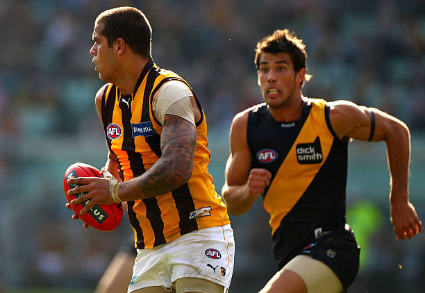 Lance Franklin of the Hawks takes a bounce as he runs the ball out of the back line during the round eight AFL match between the Richmond Tigers and...