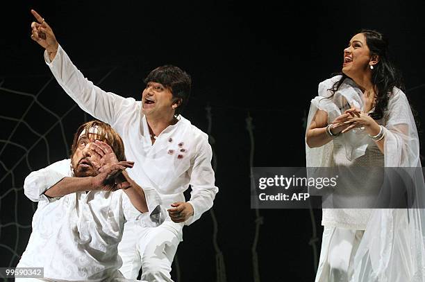 Indian Bollywood actors Shakti Kapoor , Naveen Bawa and Padmini Kolhapure perform during the Hindi play "Aasman Se Gira Khajoor Pe Atka" in Mumbai on...