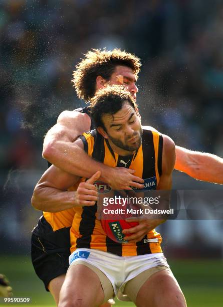 Jordan Lewis of the Hawks is tackled by Chris Newman of the Tigers during the round eight AFL match between the Richmond Tigers and the Hawthorn...