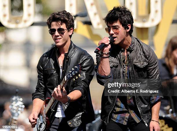 Musician Nick Jonas and musician Joe Jonas perform live at the Grove to kick off the summer concert series on May 15, 2010 in Los Angeles, California.