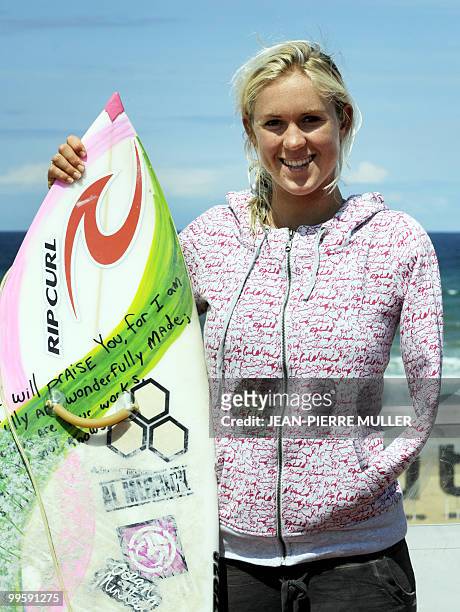 Hawaiian surfer Bethany Hamilton poses on May 14, 2010 with her surf-board on the beach in Soorts-Hossegor, western France, during the Swatch Girls...