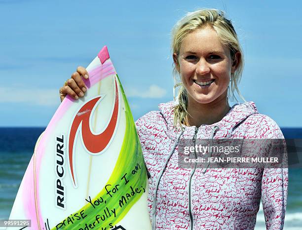 Hawaiian surfer Bethany Hamilton poses on May 14, 2010 with her surf-board on the beach in Soorts-Hossegor, western France, during the Swatch Girls...