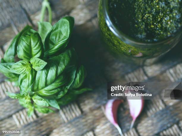 fresh basil and pesto sauce - pesto stock pictures, royalty-free photos & images