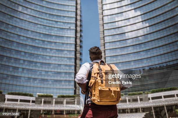 businessman with backpack - milan skyscraper stock pictures, royalty-free photos & images