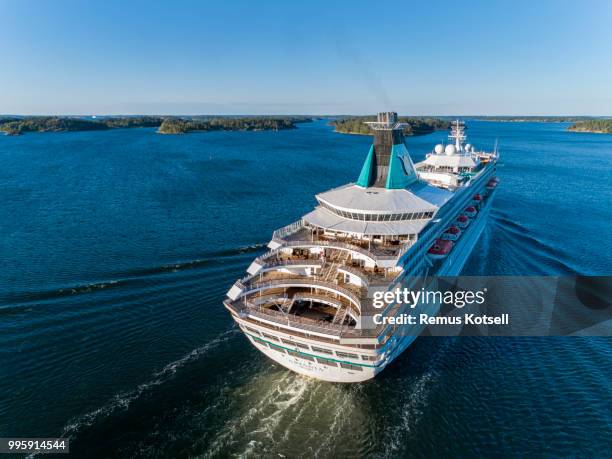 artania cruiser ship passing by in the stockholm swedish archipelago - remus kotsell stock pictures, royalty-free photos & images