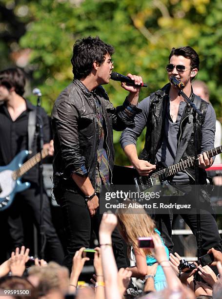 Musician Joe Jonas and musician Kevin Jonas perform live at the Grove to kick off the summer concert series on May 15, 2010 in Los Angeles,...