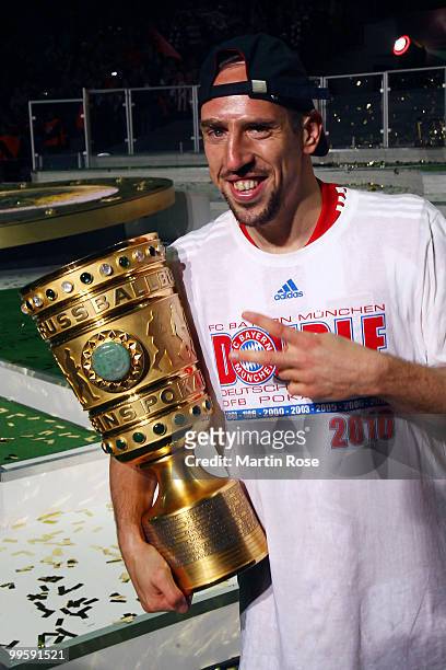 Franck Ribery of Bayern presents the trophy after winning the DFB Cup final match between SV Werder Bremen and FC Bayern Muenchen at Olympic Stadium...