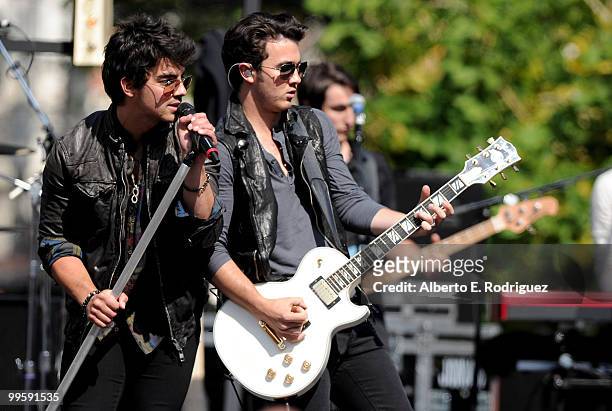 Musician Joe Jonas and musician Kevin Jonas perform live at the Grove to kick off the summer concert series on May 15, 2010 in Los Angeles,...