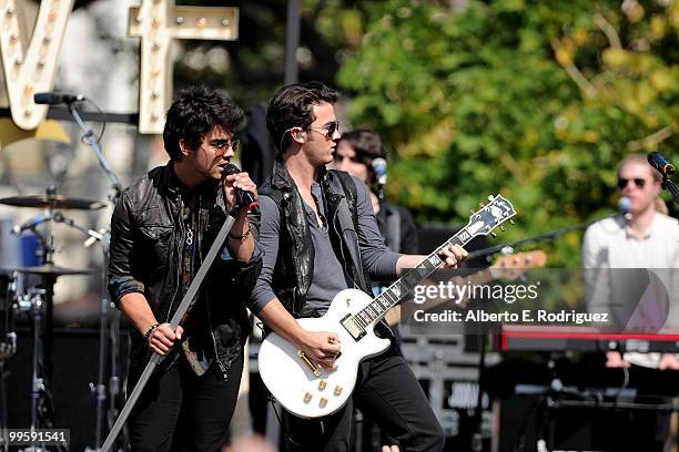 Musician Joe Jonas and musician Kevin Jonas perform live at the Grove to kick off the summer concert series on May 15, 2010 in Los Angeles,...