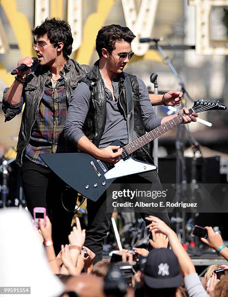 Musician Joe Jonas and musician Kevin Jonas perform live at the Grove to kick off the summer concert series on May 15, 2010 in Los Angeles,...