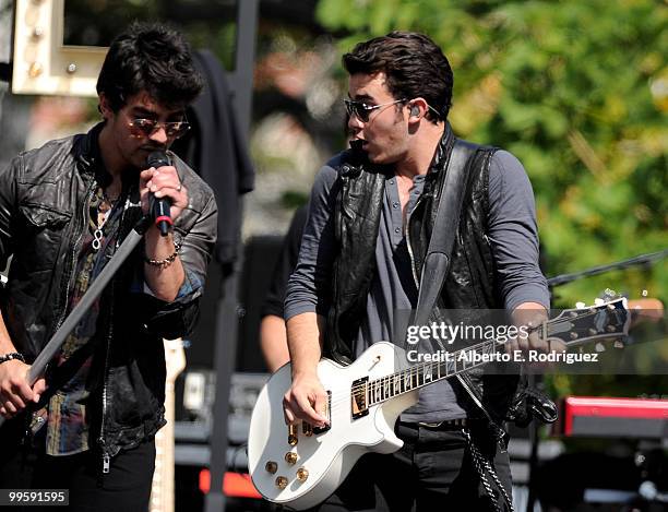 Musician Joe Jonas and musician Kevin Jonas perform live at the Grove to kick off the summer concert series on May 15, 2010 in Los Angeles,...