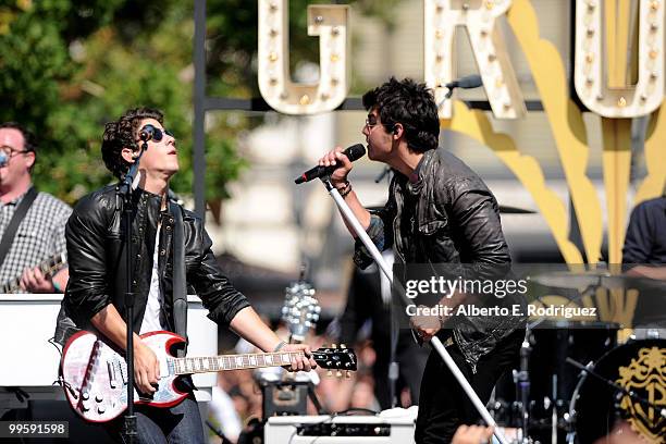 Musician Nick Jonas and musician Joe Jonas perform live at the Grove to kick off the summer concert series on May 15, 2010 in Los Angeles, California.