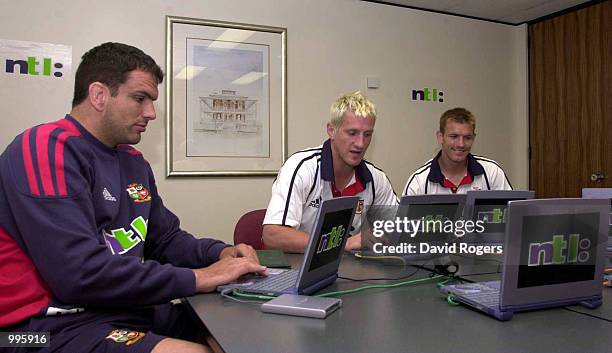 Martin Johnson, Will Greenwood and Dafydd James use the Lions computer room following training today at the Brisbane Grammer School ahead of their...