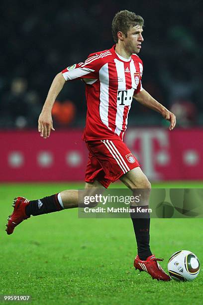 Thomas Mueller of Bayern runs with the ball during the DFB Cup final match between SV Werder Bremen and FC Bayern Muenchen at Olympic Stadium on May...