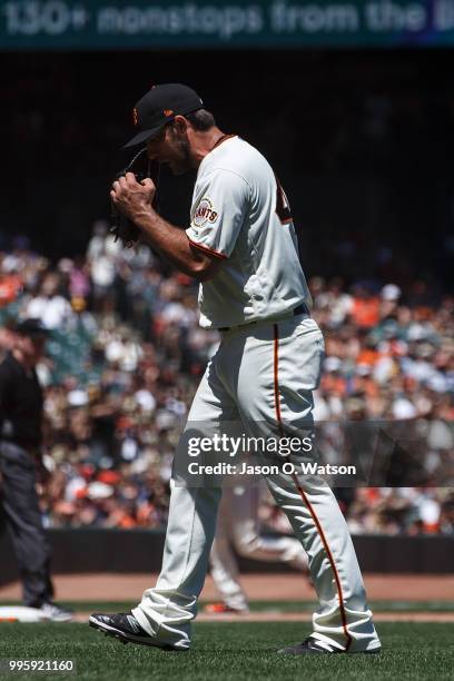 Madison Bumgarner of the San Francisco Giants reacts after allowing two run during the fourth inning against the St. Louis Cardinals at AT&T Park on...