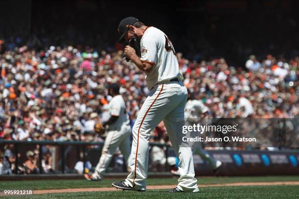 Madison Bumgarner of the San Francisco Giants reacts after allowing two run during the fourth inning against the St. Louis Cardinals at AT&T Park on...