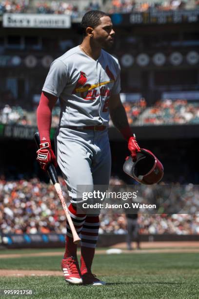 Tommy Pham of the St. Louis Cardinals returns to the dugout after striking out against the San Francisco Giants during the fifth inning at AT&T Park...