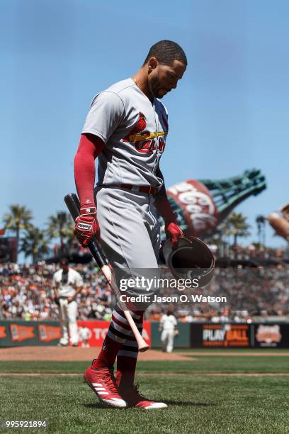 Tommy Pham of the St. Louis Cardinals returns to the dugout after striking out against the San Francisco Giants during the fifth inning at AT&T Park...