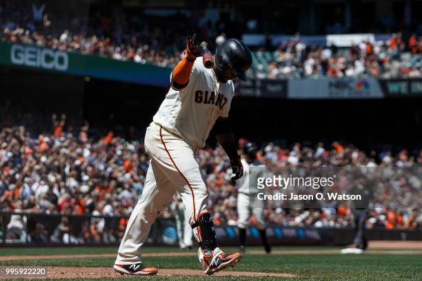 Pablo Sandoval of the San Francisco Giants flips his bat after hitting a three run home run against the St. Louis Cardinals during the fifth inning...