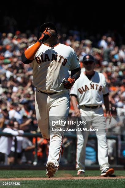 Pablo Sandoval of the San Francisco Giants celebrates after hitting a three run home run against the St. Louis Cardinals during the fifth inning at...