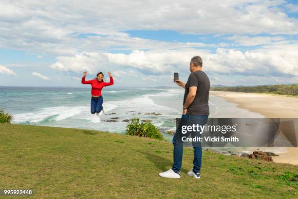 male and female couple at the beach - vicki stock pictures, royalty-free photos & images