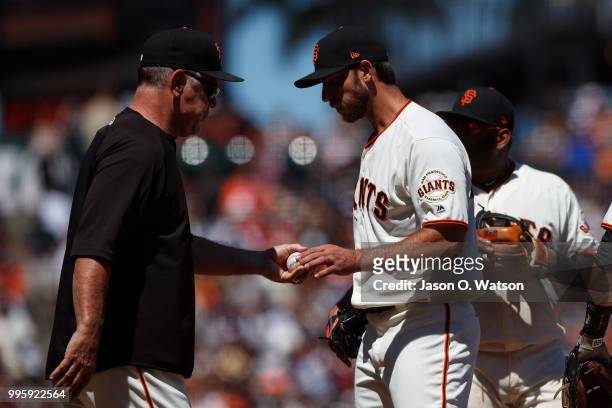 Madison Bumgarner of the San Francisco Giants is relieved by manager Bruce Bochy during the sixth inning against the St. Louis Cardinals at AT&T Park...