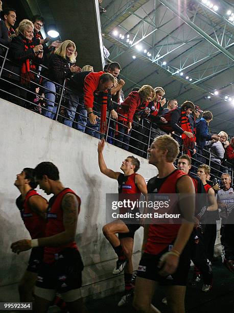 Bombers players thank their supporters as they make their way back to their dressing room after the round eight AFL match between the St Kilda Saints...