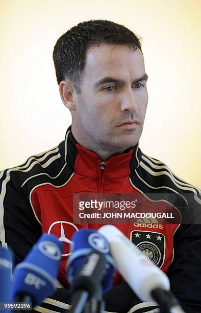 Fitness trainer Shad Forsythe addresses a press conference at the Verdura Golf and Spa resort, near Sciacca May 15, 2010. The German team is...